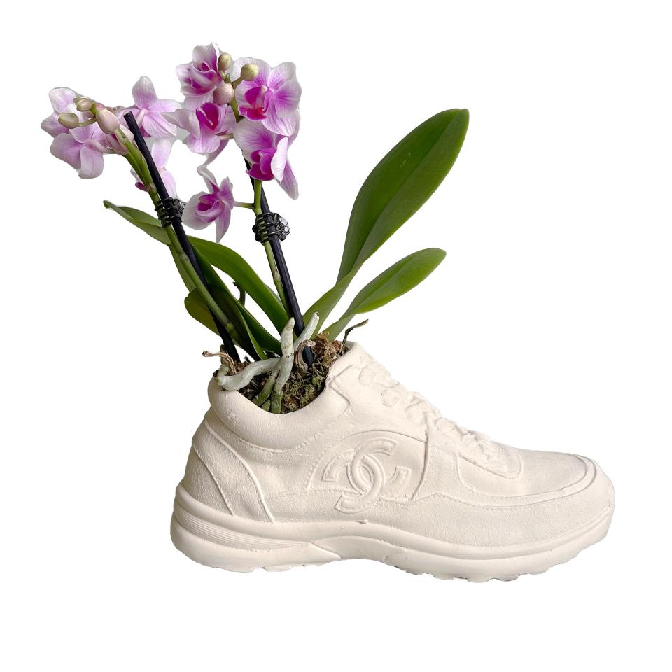 <p><a href="https://originalrose.com/products/chanel-trainer-vase/" rel="nofollow noopener" target="_blank" data-ylk="slk:Shop Now;elm:context_link;itc:0;sec:content-canvas" class="link ">Shop Now</a></p><p>Chanel Trainer Vase</p><p>originalrose.com</p><p>$175.00</p><span class="copyright">Original Rose</span>