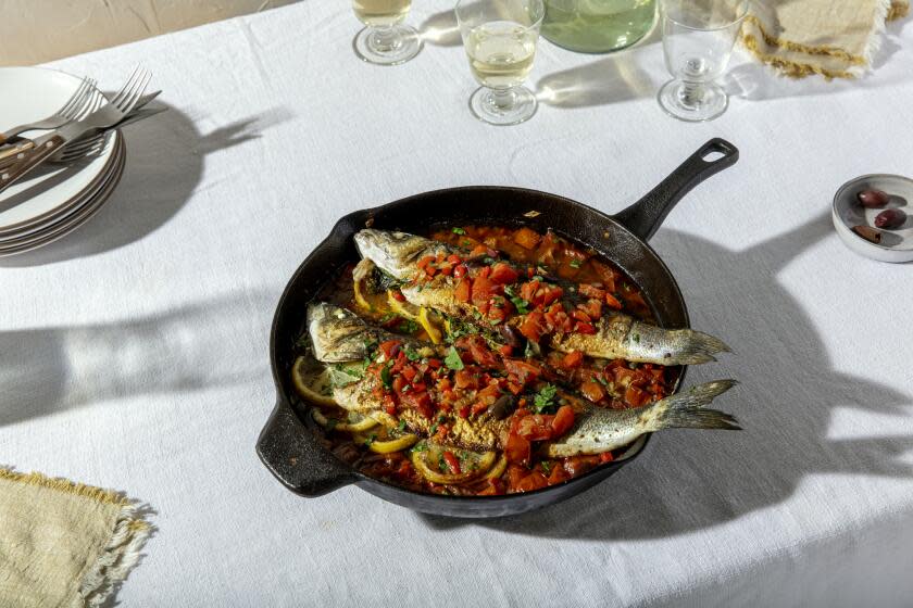 LOS ANGELES, CALIFORNIA, Dec. 1, 2020: Ben Mims' Roasted Branzino with Tomatoes and Olives from a recipe by Jonathan Melendez photographed for LA Times Food cooking section's Holiday Travel story, on Tuesday, Dec. 1, 2020, at the Proplink Studios in Arts District Los Angeles. (Silvia Razgova / For the Times, prop styling by Kate Parisian, food styling by Ben Mims) ATTN: 661373-la-fo-Holiday-Cooking