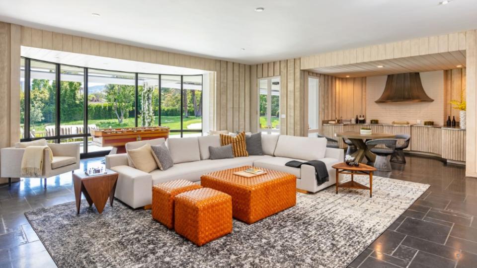 A lounge area that connects to the outdoors - Credit: Simon Berlyn