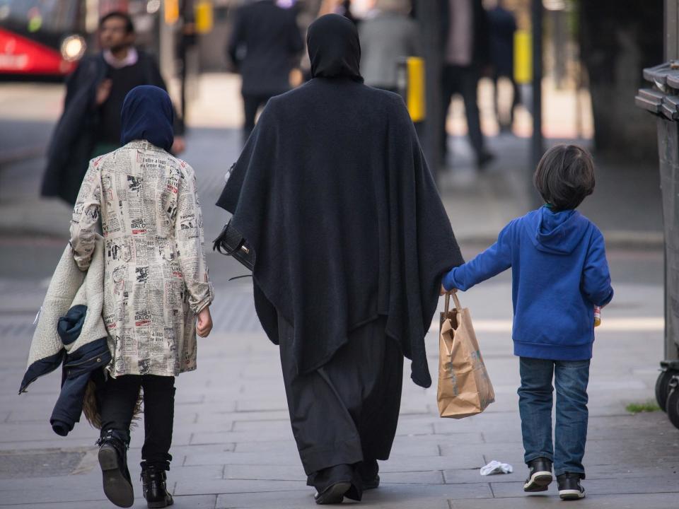 A general view of two Muslim women and a child in London: PA