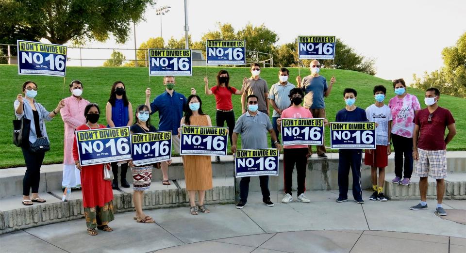 California's Proposition 16, which will be voted on this Election Day, would repeal a 24-year-old amendment to the state constitution that bans affirmative action. Those opposed to Prop 16, shown gathered in this photo, contend that the proposition could unfairly penalize groups, such as Asian Americans, who deserve university admissions and public jobs based solely on merit.