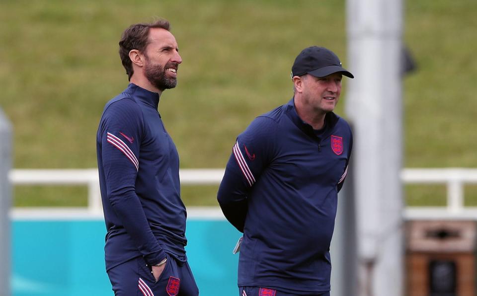 Southgate alongside England assistant manager Steve Holland - PA