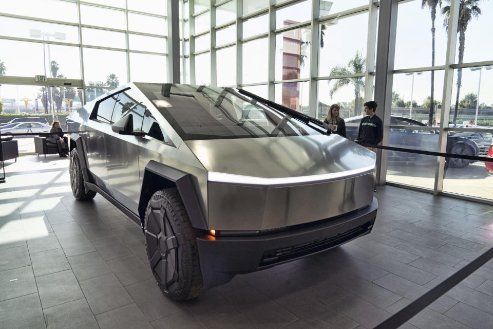 A Tesla Cybertruck is on display at the Tesla showroom in Buena Park, Calif. on Sunday Dec. 3, 2023. Tesla is recalling 3,878 of its 2024 Cybertrucks after it discovered that the accelerator pedal can become stuck, potentially causing the vehicle to accelerate unintentionally and increasing the risk of a crash. (AP Photo/Richard Vogel)