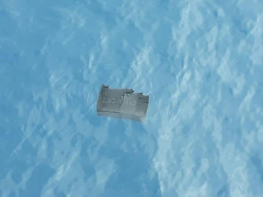 A piece of debris believed to be from the missing plane is shown in this Chilean Air Force photo