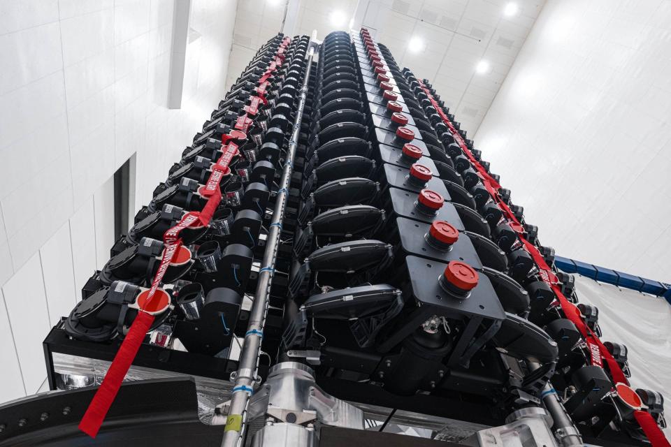 This photo shows a stack of SpaceX's Starlink V2 Mini satellites during payload processing before being encapsulated inside the protective nosecone fairing of a Falcon 9 rocket.