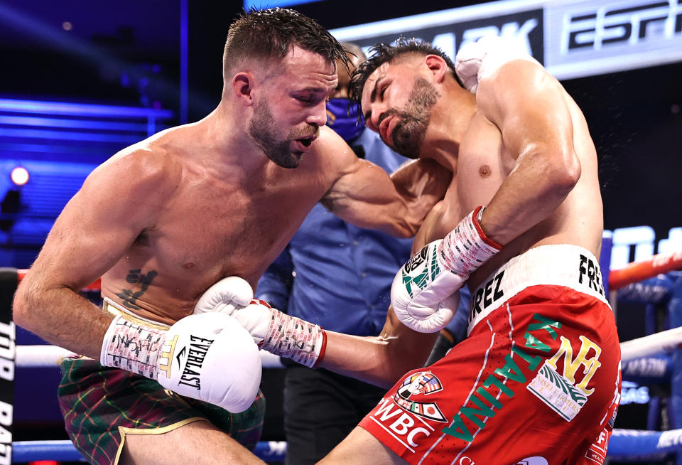 LAS VEGAS, NEVADA - MAY 22: Josh Taylor(L) and Jose Ramirez(R) exchange punches during their fight for the Undisputed junior welterweight championship at Virgin Hotels Las Vegas on May 22, 2021 in Las Vegas, Nevada. (Photo by Mikey Williams/Top Rank Inc via Getty Images)