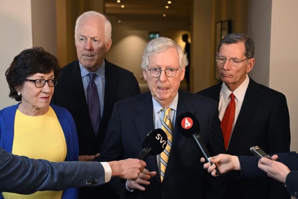 U.S. Republican Sens. Mitch McConnell, center, and from left, Susan Collins, John Cornyn and John Barrasso speak with Swedish media at the Grand Hotel in Stockholm after a meeting with Swedish Prime Minister Magdalena Andersson and Minister of Defense Peter Hultqvist on Sunday, May 15, 2022. McConnell said Sunday that Finland and Sweden would be “important additions” to NATO as he led a delegation of GOP senators to the region in a show of support against Russia's aggression. (Anders Wiklund/TT News Agency via AP)