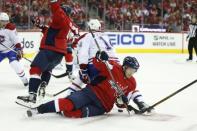 Oct 7, 2017; Washington, DC, USA; Washington Capitals center Lars Eller (20) falls on the ice while battling for the puck with Montreal Canadiens center Tomas Plekanec (14) during the second period at Verizon Center. The Capitals won 6-1. Mandatory Credit: Amber Searls-USA TODAY Sports