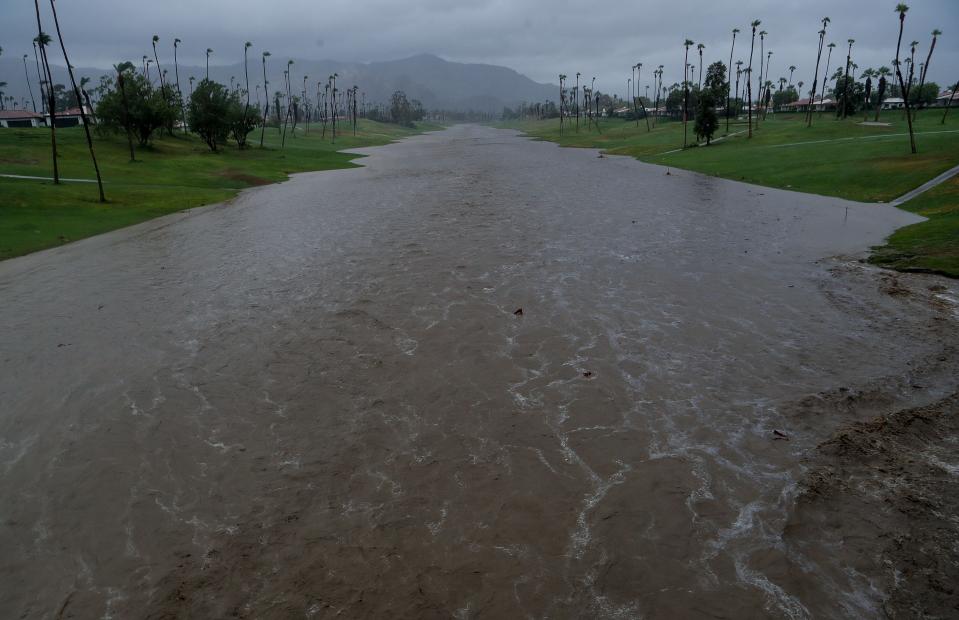 The normally dry Whitewater River flows through the wash at Monterey Country Club in Palm Desert, Calif., August 20, 2023.