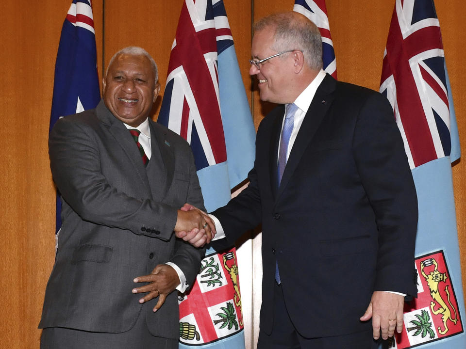 Australia's Prime Minister Scott Morrison, right, and Fiji's Prime Minister Voreqe Bainimarama pose for a photo after an official welcome ceremony at Parliament House in Canberra, Monday, Sept. 16, 2019. (Mick Tsikas/Pool Photo via AP)