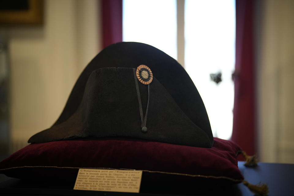 One of the signature broad, black hats that Napoléon wore when he ruled 19th century France and waged war in Europe is on display at Osenat's auction house in Fontainebleau, south of Paris, Friday, Nov. 17, 2023. The hat is tipped to fetch more than half a million euros (dollars) at the auction Sunday of Napoleonic memorabilia patiently collected by a French industrialist. (AP Photo/Christophe Ena)