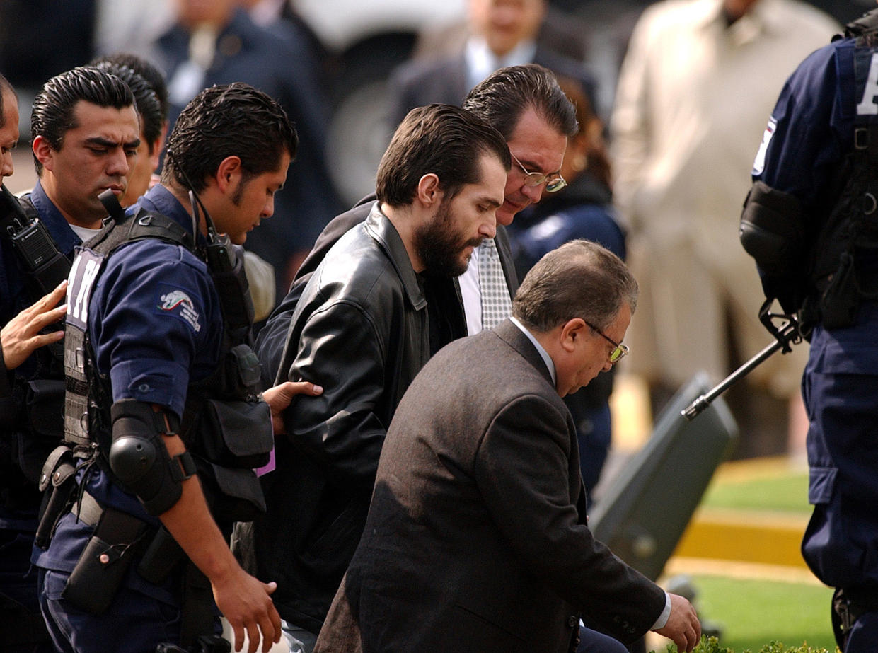 ** RETRANSMIT TO CORRECT PHOTOGRAPHER BYLINE TO EDUARDO VERDUGO **  Mexican businesman Carlos Ahumada arrives in the Mexico City international airport Wednesday, April 28, 2004, after being deported from Cuba. Ahumada, the businessman arrested in Cuba last month in a Mexico City corruption probe, will face prosecution by mexican authorities. (AP Photo/Eduardo Verdugo)