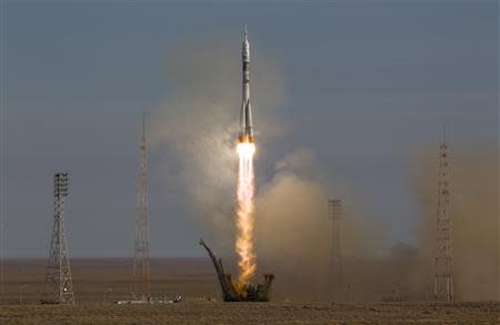 The Soyuz TMA-11M spacecraft blasts off from the launch pad at the Baikonur cosmodrome