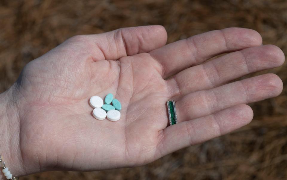 Natalie Rockwell, a transgender woman, shows her medication Friday, May 26, 2023. Rockwell takes estrogen and testosterone blockers,  but recent legislation putting new restrictions on gender-affirming care have made accessing the medication much more difficult.