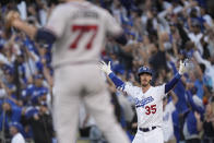 Los Angeles Dodgers center fielder Cody Bellinger reacts after hitting a three-run home run during the eighth inning in Game 3 of baseball's National League Championship Series against the Atlanta Braves Tuesday, Oct. 19, 2021, in Los Angeles. (AP Photo/Jae Hong)