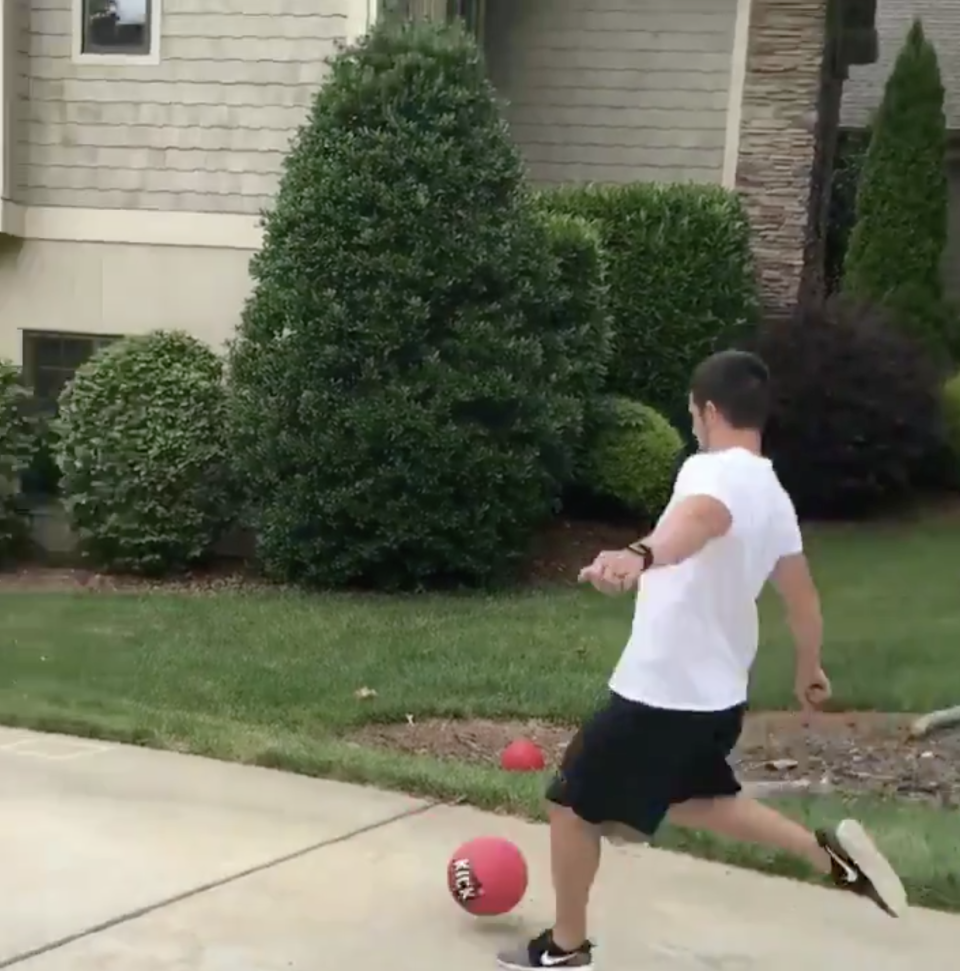 Panthers kicker Graham Gano kicked a ball out well of his driveway and over the trees during a family game of kickball. (Twitter/Graham Gano)