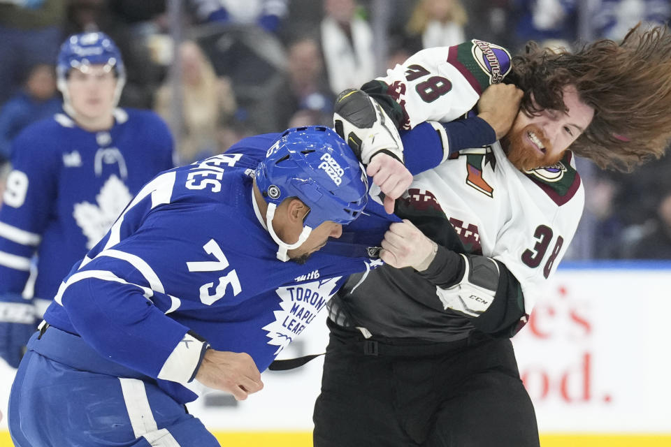 Toronto Maple Leafs' Ryan Reaves (75) Arizona Coyotes' Liam O'Brien, right, fight during first-period NHL hockey game action in Toronto, Thursday, Feb. 29, 2024. (Chris Young/The Canadian Press via AP)