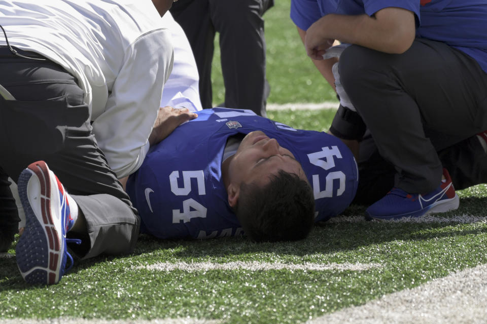 New York Giants inside linebacker Blake Martinez lies on the field after an apparent injury during the first half of an NFL football game against the Atlanta Falcons, Sunday, Sept. 26, 2021, in East Rutherford, N.J. (AP Photo/Bill Kostroun)