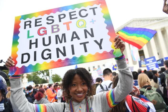 Demonstrators in favor of LGBT rights rally outside the U.S. Supreme Court in Washington, D.C., Oct. 8, 2019, as the Court holds oral arguments in three cases dealing with workplace discrimination based on sexual orientation. (Photo by SAUL LOEB/AFP via Getty Images)