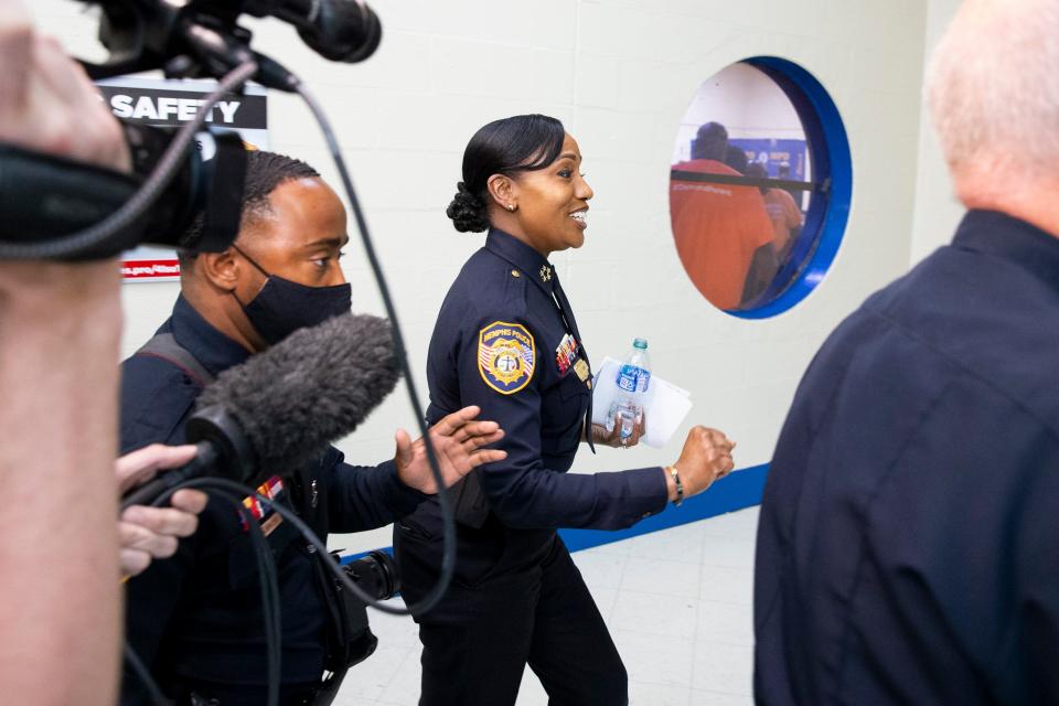 Memphis Police Chief Cerelyn “CJ” Davis is escorted out of  the Greenlaw Community Center community meeting as members of the press attempt to ask her questions in Memphis, Tenn., on Tuesday, May 23, 2023. MPD hosted the meeting to discuss the future of the center with residents of the Greenlaw area. 