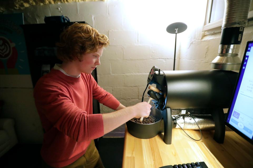 Ian McKay, 17, dispenses roasted coffee beans to fill a a customers order. He runs his coffee roasting business Wonder-Kind Coffee Roasters out of his parent's basement located at 1001 South Lawe Street in Appleton. He is pictured here in his work area Wednesday, November 8, 2023, in Appleton, Wis.
Dan Powers/USA TODAY NETWORK-Wisconsin.