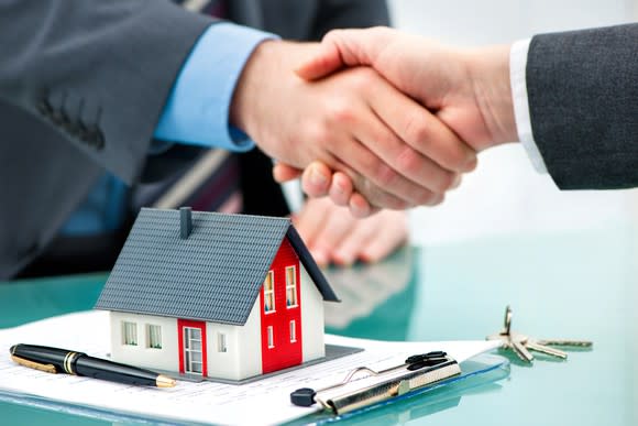 Handshake over mortgage documents