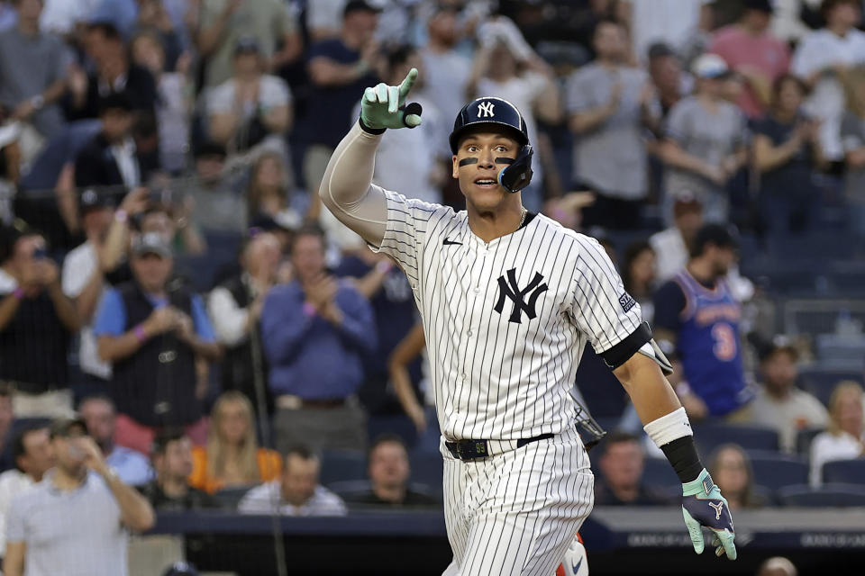 New York Yankees' Aaron Judge gestures after hitting a home run against the Houston Astros during the third inning of a baseball game Wednesday, May 8, 2024, in New York. (AP Photo/Adam Hunger)