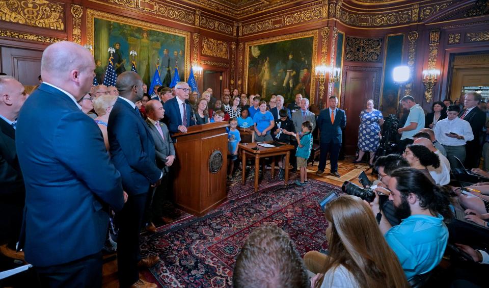 Wisconsin Governor Tony Evers, center, holds press conference before signing the biennial budget at the State Capitol in Madison on Wednesday, July 5, 2023.