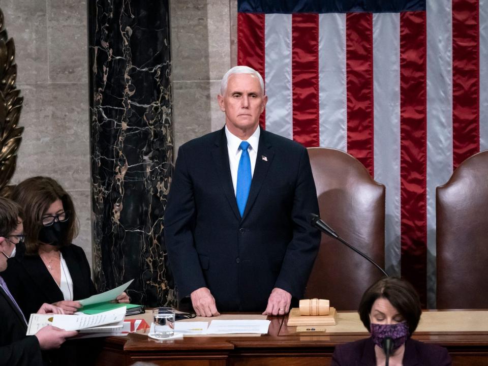 Vice President Mike Pence returns to the House chamber after midnight, Jan. 7, 2021, to finish the work of the Electoral College after a mob loyal to President Donald Trump stormed the Capitol in Washington and disrupted the process.