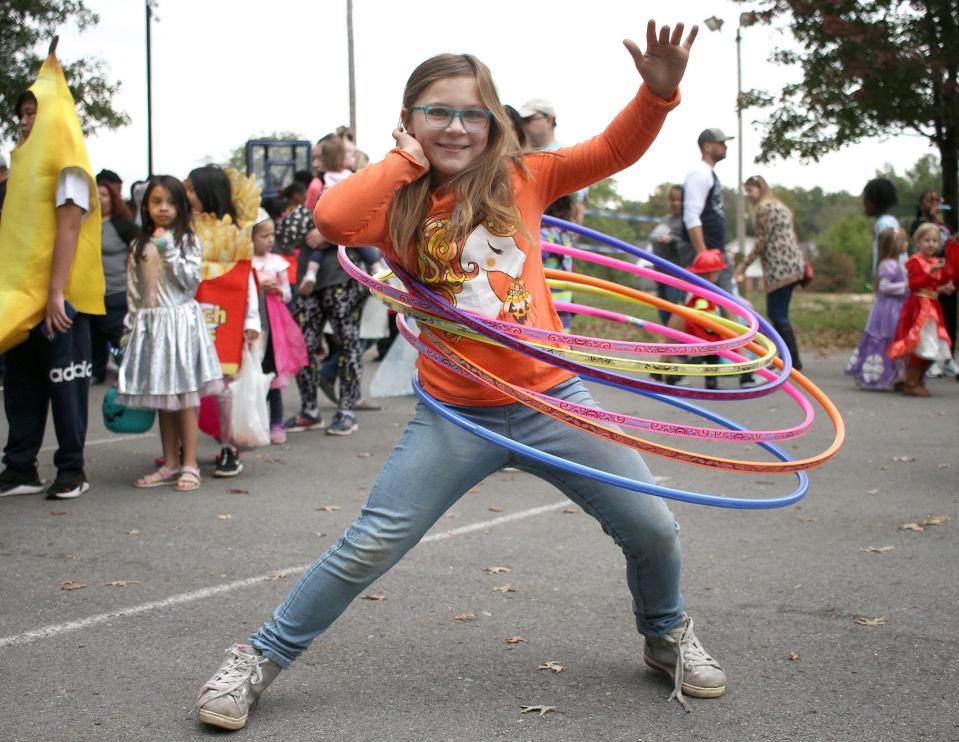 Alexis McClendon, a professional Hula-Hooper, shows how it's done at the Moss-Wright Halloween event in 2021.