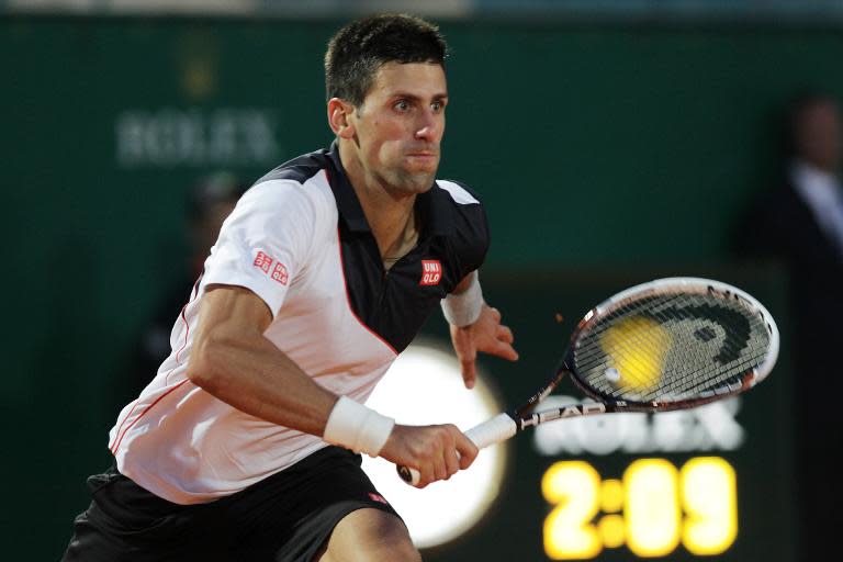 Serbia's Novak Djokovic runs for the ball during his Monte-Carlo ATP Masters Series Tournament match against Spain's Guillermo Garcia-Lopez on April 18, 2014 in Monaco