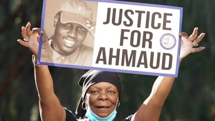 Beverly Green of the Transformative Justice Coalition demonstrates Monday at the Glynn County Courthouse, where jury selection began in the trial of the defendants in the shooting death of Ahmaud Arbery in Brunswick, Georgia. (Photo: Sean Rayford/Getty Images)