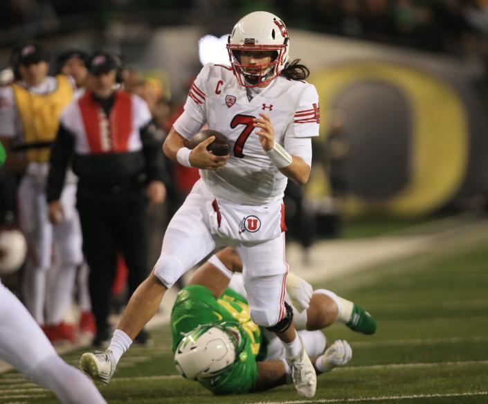 Utah's Cameron Rising rushes on a quarterback keeper against Oregon during the second half in final home game of season for the Ducks at Autzen Stadium.