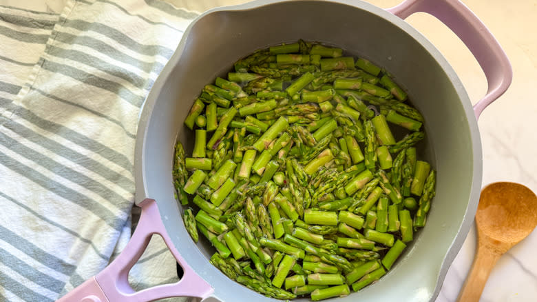 pot with chopped asparagus