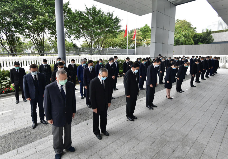 HONG KONG, April 4, 2020  -- Chief Executive of the Hong Kong Special Administrative Region  Carrie Lam, together with the president of the Legislative Council, Executive Council members and principal officials of the HKSAR government, observe three minutes of silence at the Chief Executive's Office in Hong Kong, south China, April 4, 2020. (Photo by Xinhua via Getty)