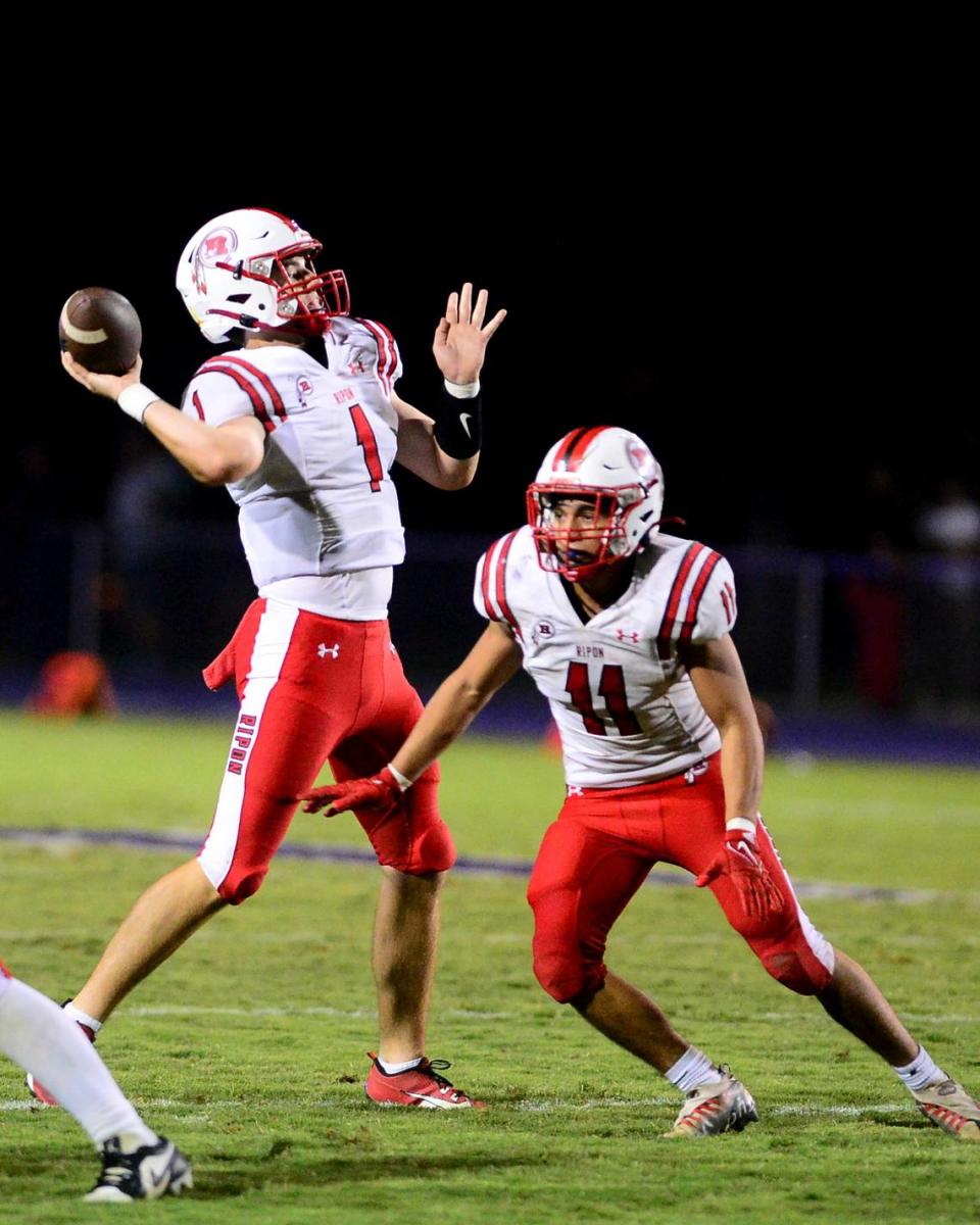 Ripon quarterback Ty Herrin (1) throws a deep pass during a game between Escalon High School and Ripon High School in Escalon, California on October 20, 2023. 