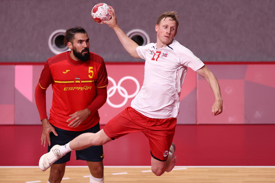 <p>TOKYO, JAPAN - JULY 26: Magnus Joendal of Team Norway shoots at goal whilst Jorge Maqueda Peno of Team Spain looks on during the Men's Preliminary Round Group A match between Spain and Norway on day three of the Tokyo 2020 Olympic Games at Yoyogi National Stadium on July 26, 2021 in Tokyo, Japan. (Photo by Dean Mouhtaropoulos/Getty Images)</p> 