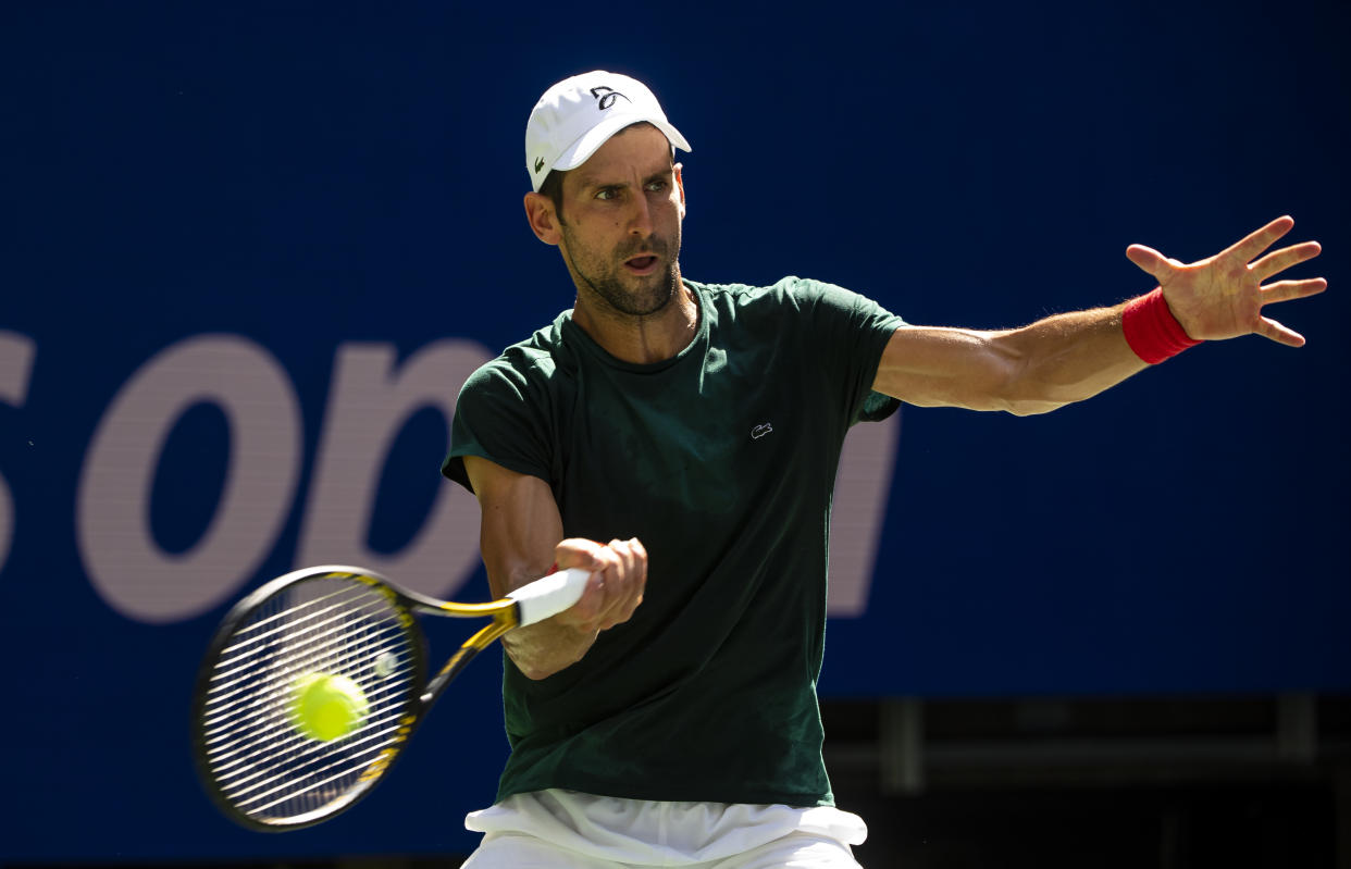 NEW YORK, NEW YORK - AUGUST 24: Novak Djokovic of Serbia practices with Casper Rudd of Norway before the start of the US Open at the USTA Billie Jean King National Tennis Center on August 24, 2021 in New York City. (Photo by TPN/Getty Images)