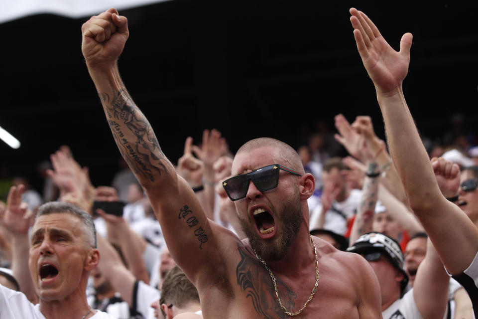 Fans cheer before the Europa League final soccer match between Eintracht Frankfurt and Rangers FC at the Ramon Sanchez Pizjuan stadium in Seville, Spain, Wednesday, May 18, 2022. (AP Photo/Pablo Garcia)