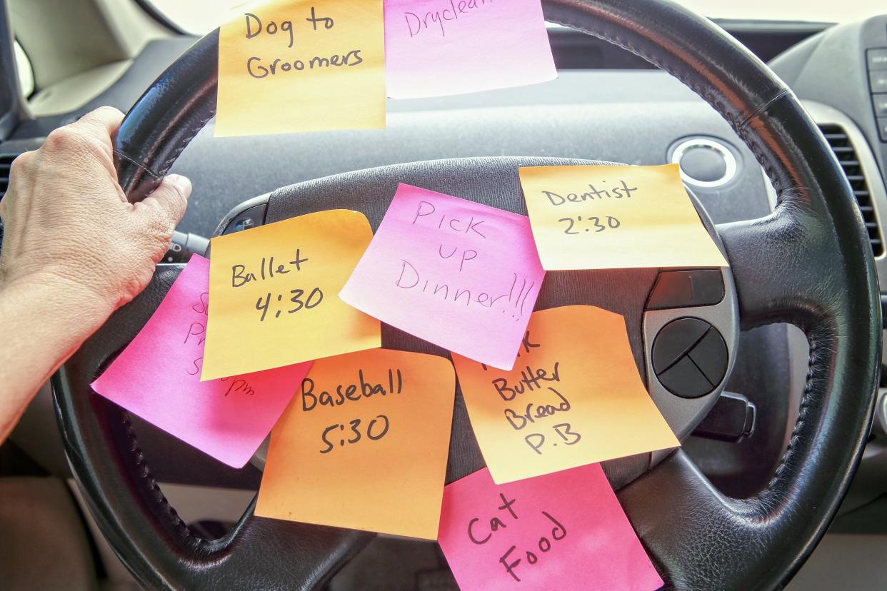 steering wheel covered in notes as a reminder of errands to do