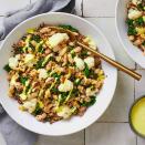 <p>This one-pan meal packs in lots of plant-based protein and flavor thanks to beans and quinoa, while a creamy lemon-garlic dressing completes the dish. <a href="https://www.eatingwell.com/recipe/7960745/winter-greens-bowl/" rel="nofollow noopener" target="_blank" data-ylk="slk:View Recipe;elm:context_link;itc:0;sec:content-canvas" class="link ">View Recipe</a></p>