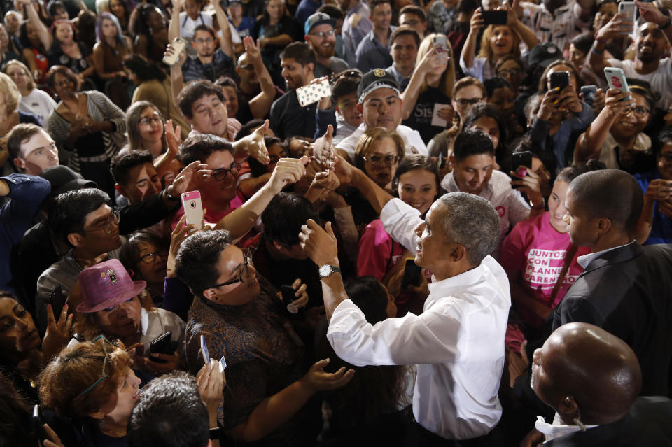 Former President Barack Obama meets with people at a rally in support of candidate for Senate Jacky Rosen and other Nevada Democrats, Monday, Oct. 22, 2018, in Las Vegas. (AP Photo/John Locher)