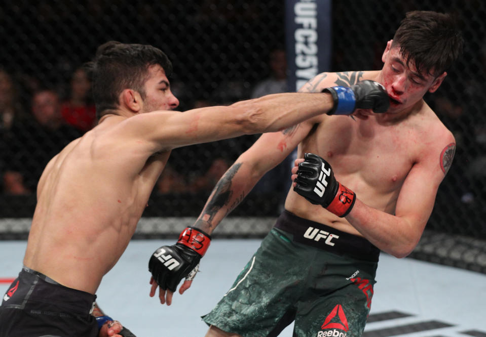 SANTIAGO, CHILE - MAY 19:  (L-R) Alexandre Pantoja of Brazil punches Brandon Moreno of Mexico in their flyweight bout during the UFC Fight Night event at Movistar Arena on May 19, 2018 in Santiago, Chile. (Photo by Buda Mendes/Zuffa LLC/Zuffa LLC via Getty Images)