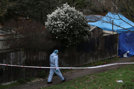 A forensic officer walks towards a property where the body of Laureline Garcia-Bertaux was found in Kew, London, Britain March 7, 2019. REUTERS/Simon Dawson