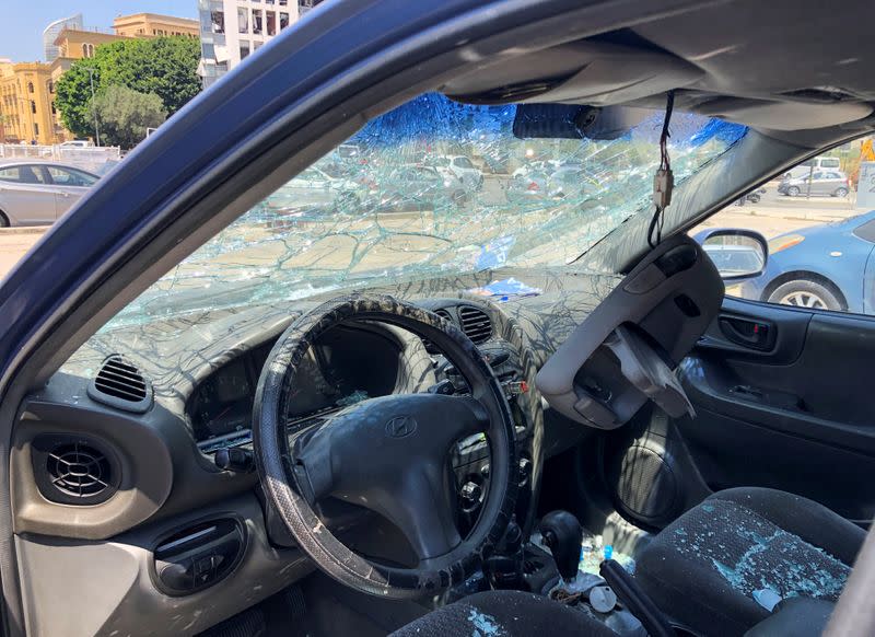 A vehicle that belongs to TV producer Yara Abi Nader is pictured with shattered windows a day after a blast in Beirut's port area