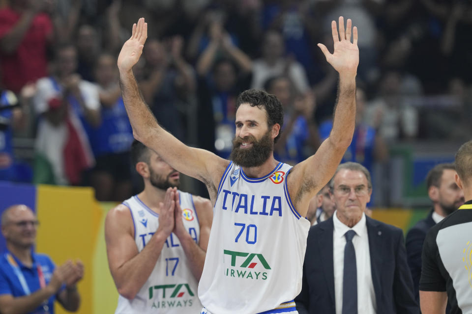 Italy forward Luigi Datome (70) acknowledge the cheers from the crowd during the Basketball World Cup classification match against Slovenia in Manila, Philippines, Saturday, Sept. 9, 2023. (AP Photo/Aaron Favila)