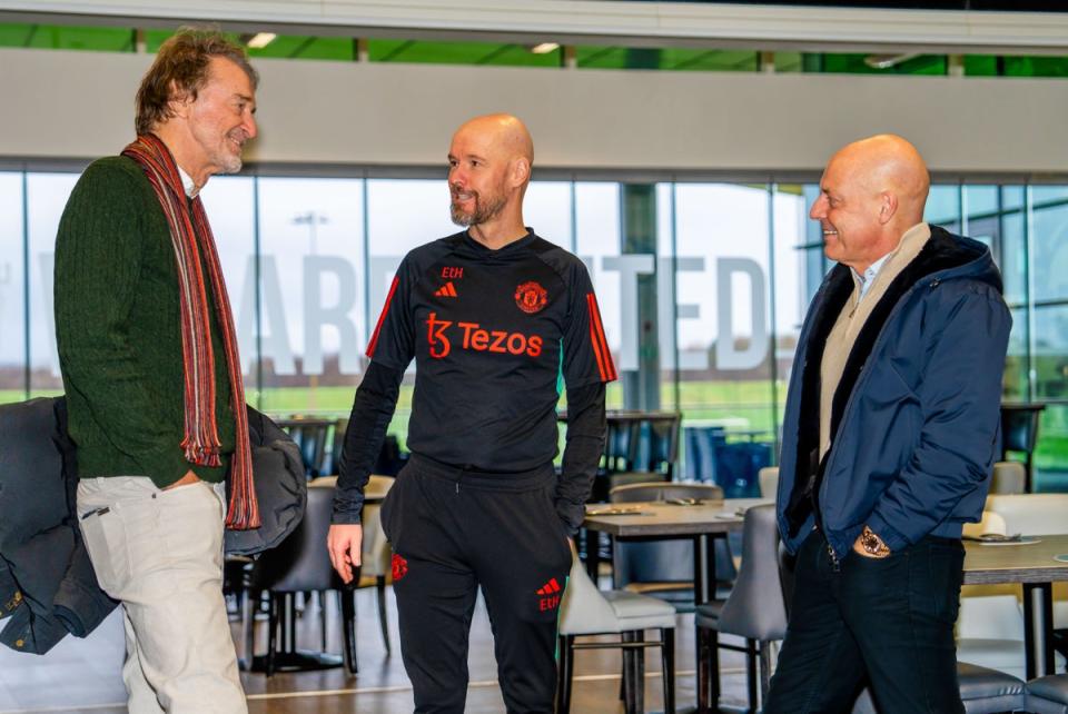 Sir Jim Ratcliffe and Sir Dave Brailsford of INEOS meet Manager Erik ten Hag of Manchester United in the staff restaurant at Carrington Training Complex (Manchester United via Getty Imag)