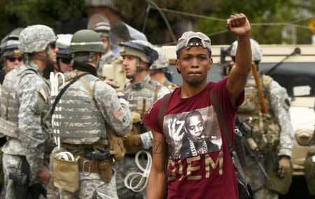 A man celebrates as people gather in the streets of Baltimore, Maryland May 1, 2015. REUTERS/Lucas Jackson