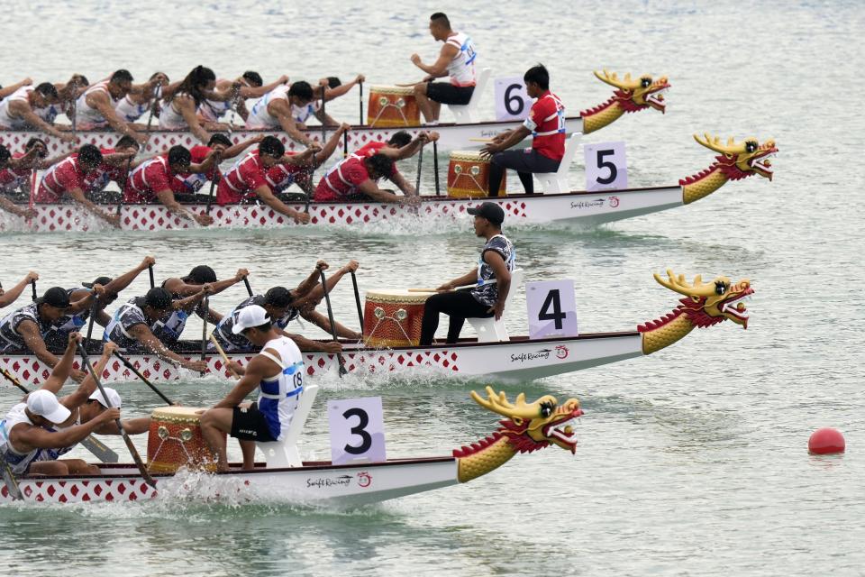 Dragon boat teams compete in the Men's Dragon Boat 500m heat during the 19th Asian Games at the Wenzhou Dragon Boat Center in Wenzhou, China, Wenzhou, Thursday, Oct. 5, 2023. (AP Photo/Eugene Hoshiko)