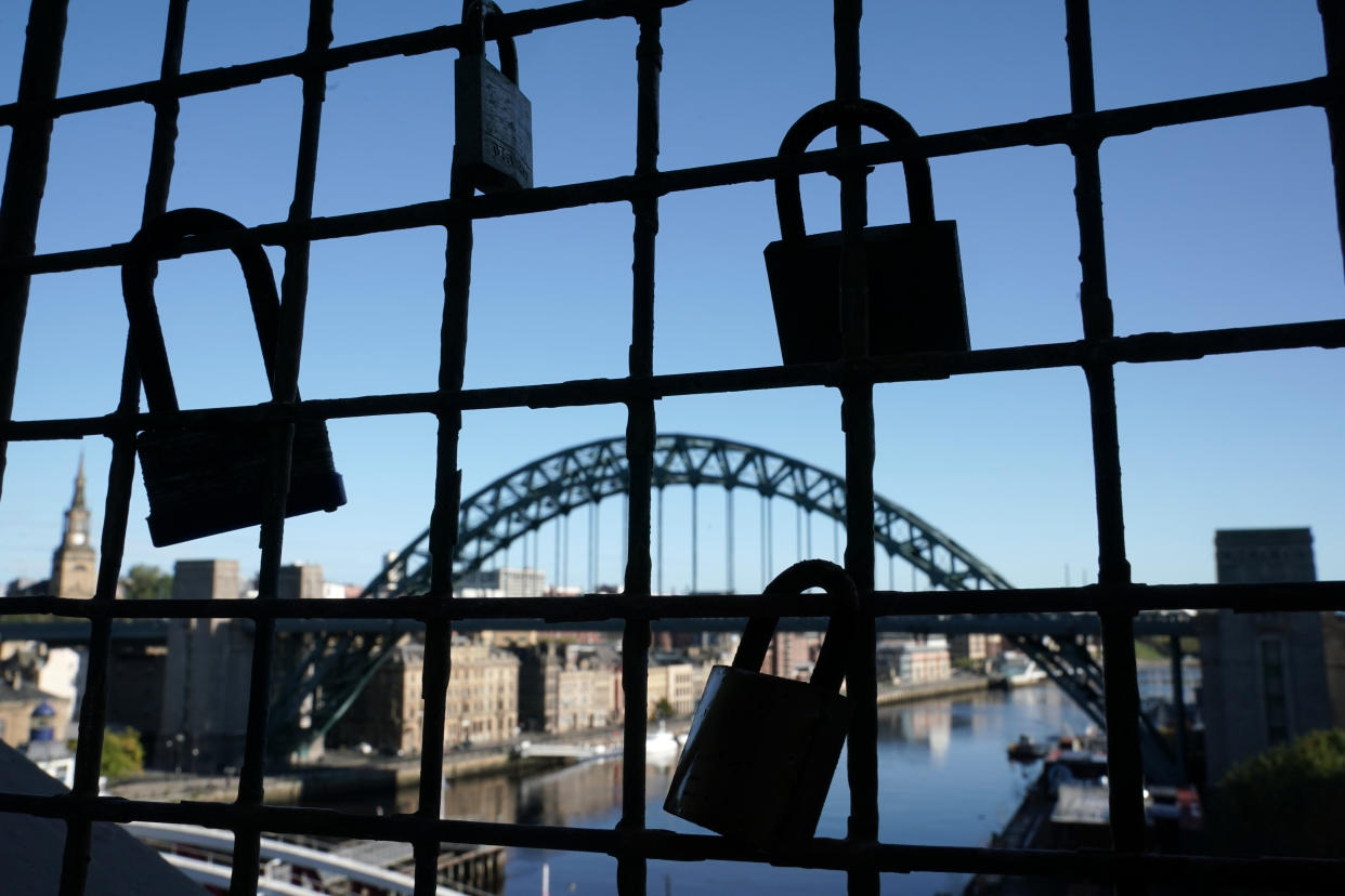 Padlocks on a bridge over the River Tyne in Newcastle. Ministers are considering imposing fresh regional restrictions amid a spike in coronavirus cases in northern England.